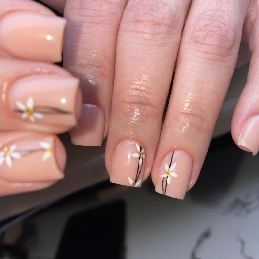 Elegant Floral Accents on Nude Nails