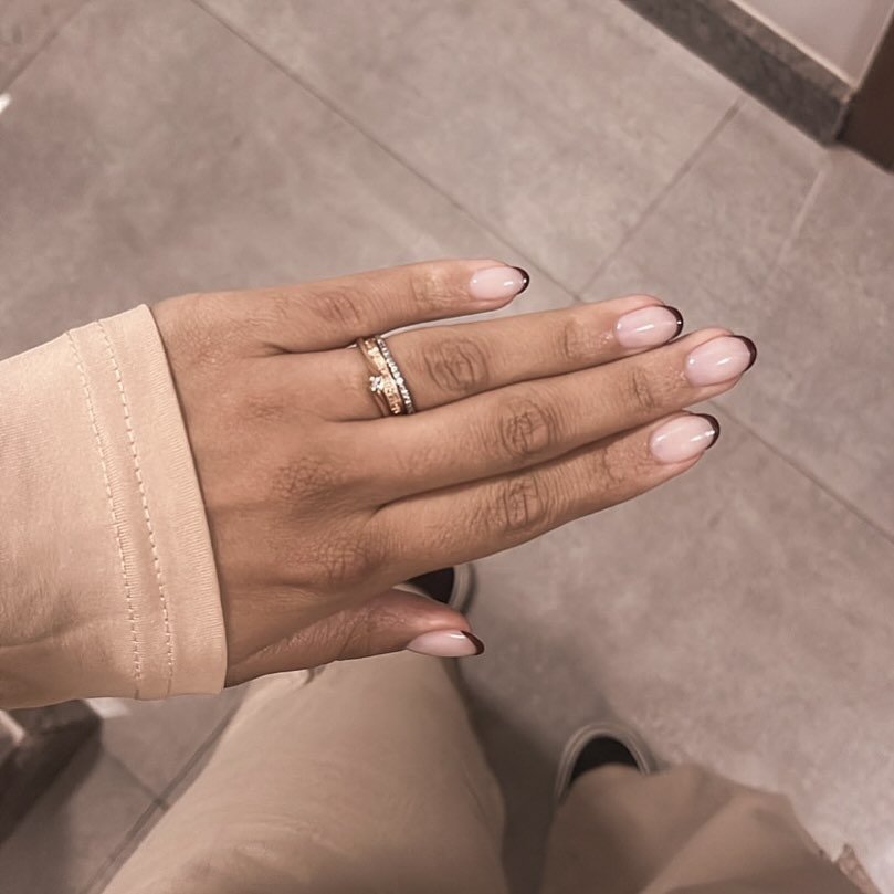 Cream Polish with Black Tips