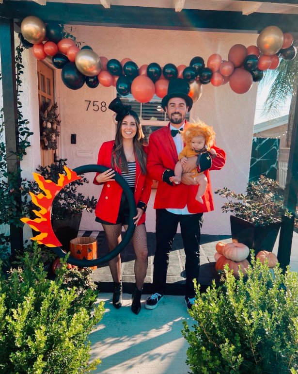 Circus Family: Ringmaster, Performer, and Baby Lion