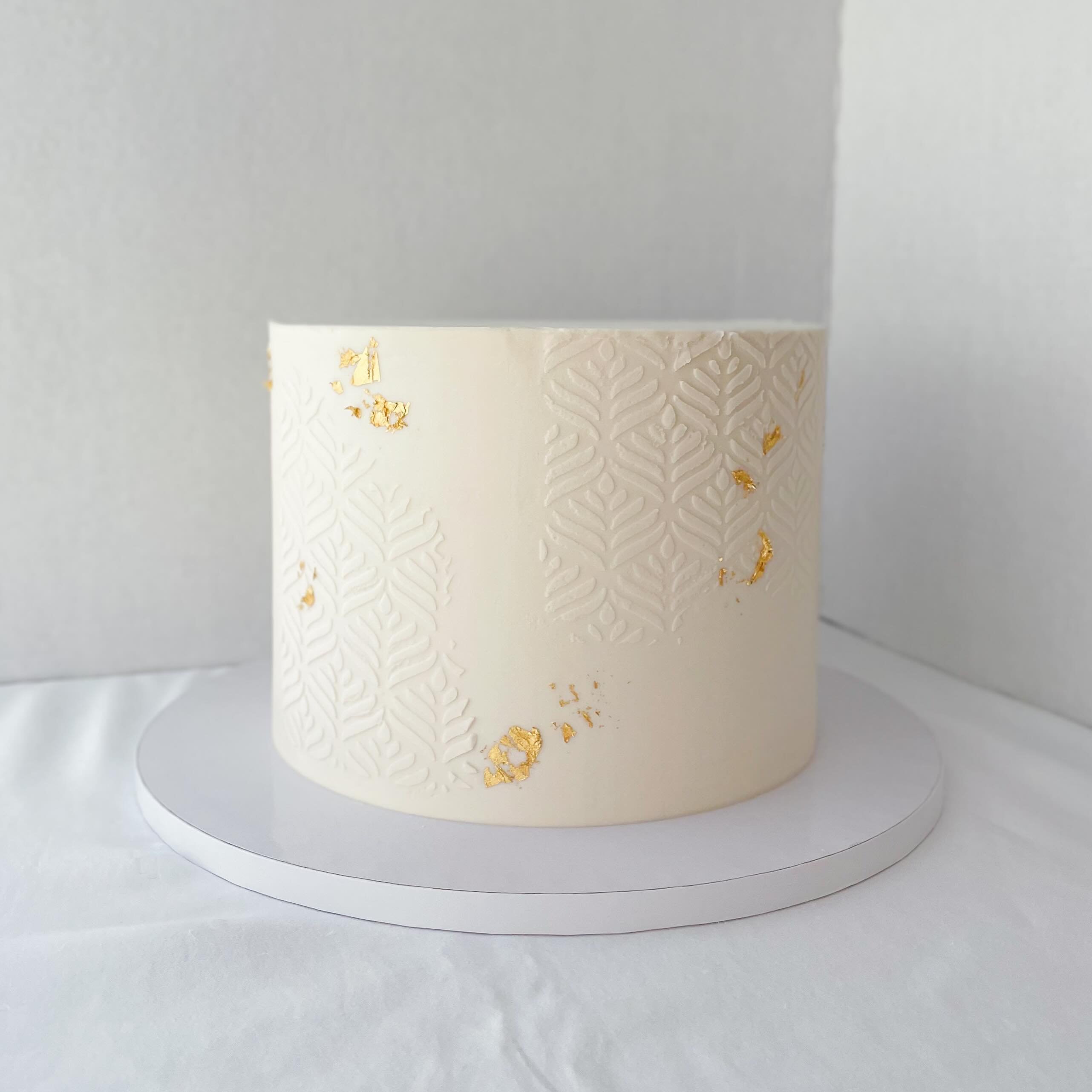 Stenciled Cake Design with Gold