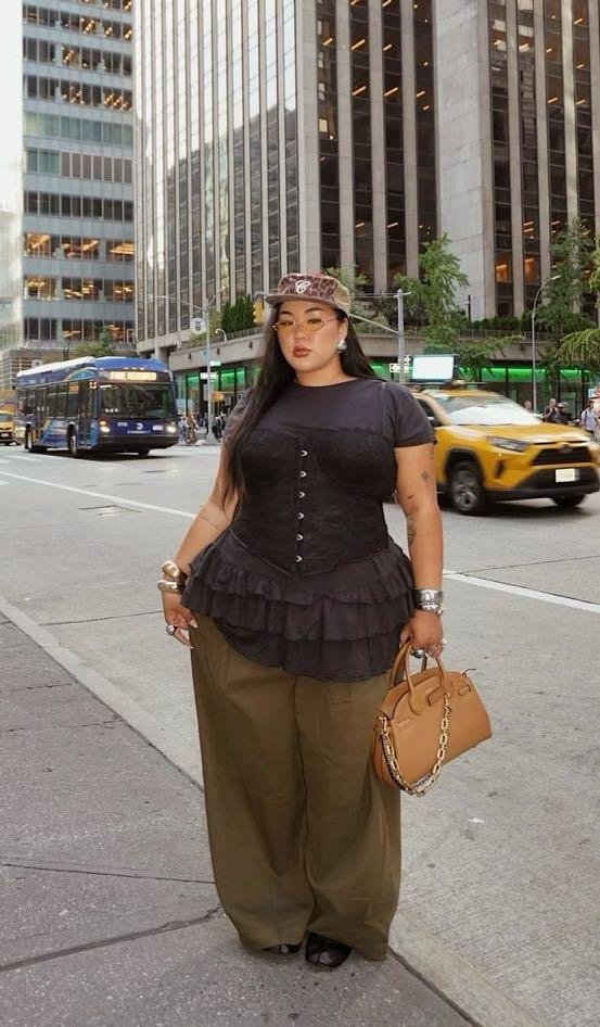 Black corset top with olive trousers