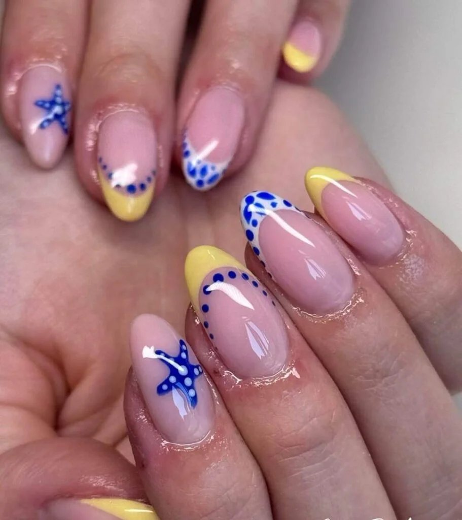 Yellow French tips with starfish accents
