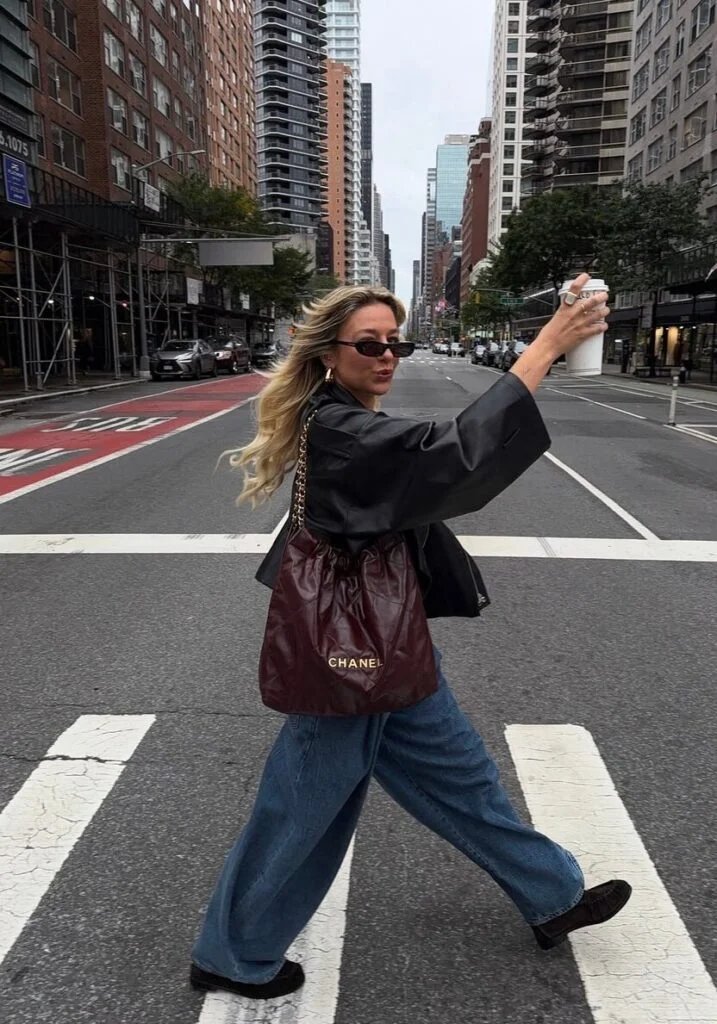 Black leather jacket with wide-leg jeans