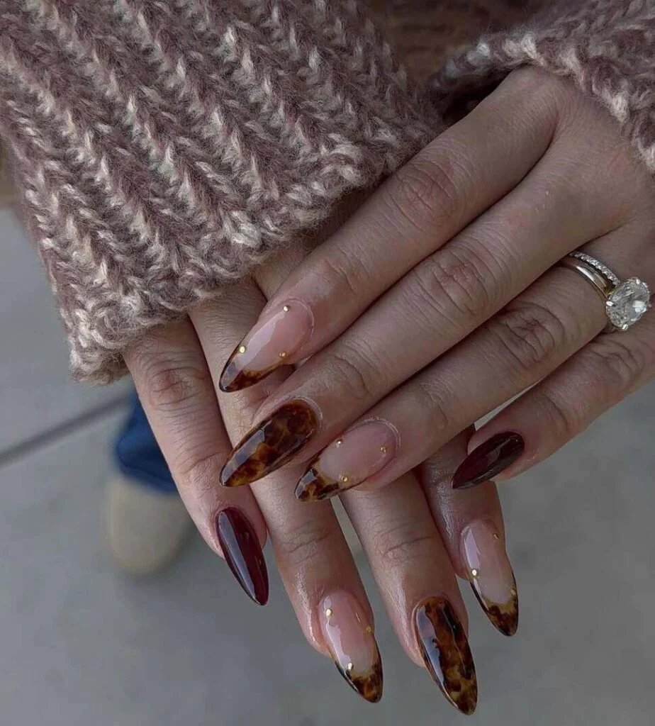 Burgundy tortoiseshell almond nails