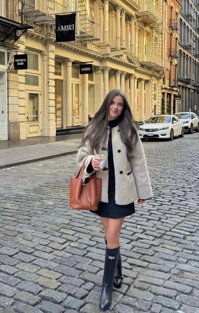 Cream shearling jacket, black boots
