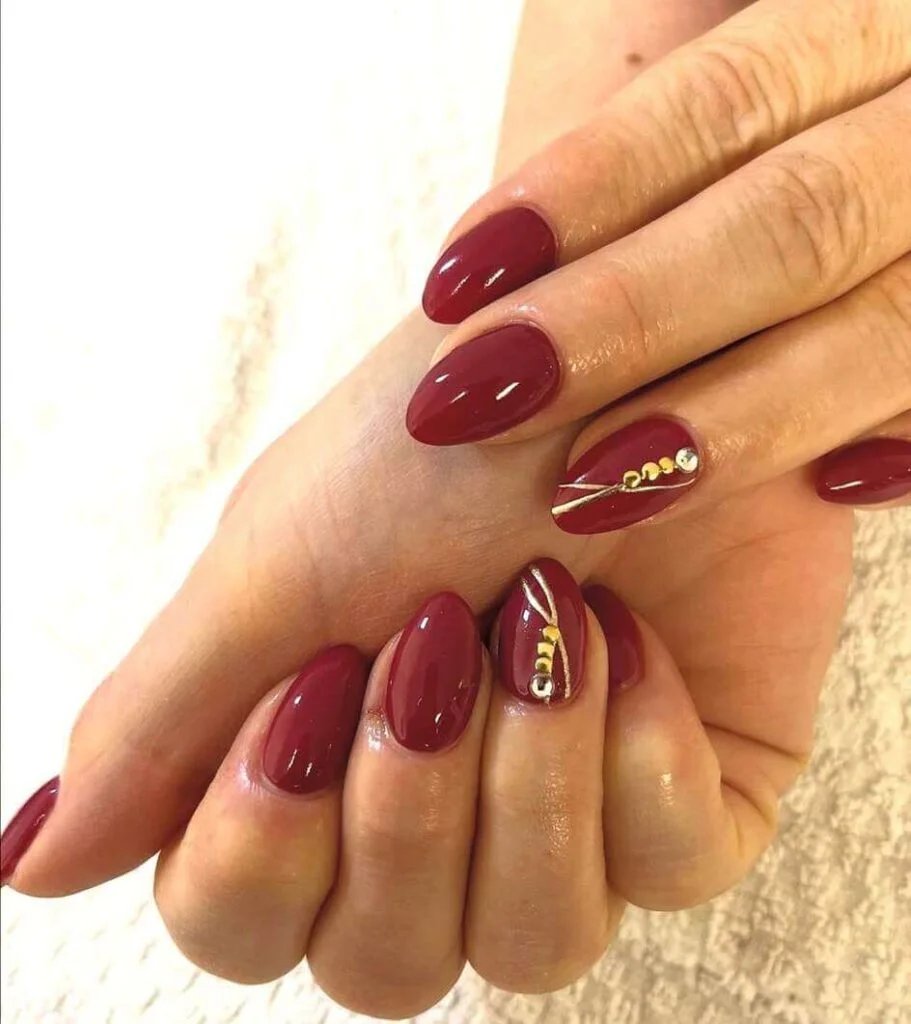 Maroon Nails with Gold Accents