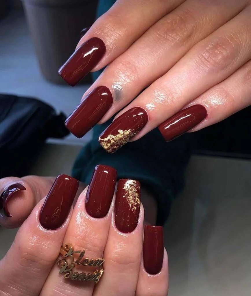 Maroon nails with gold foil