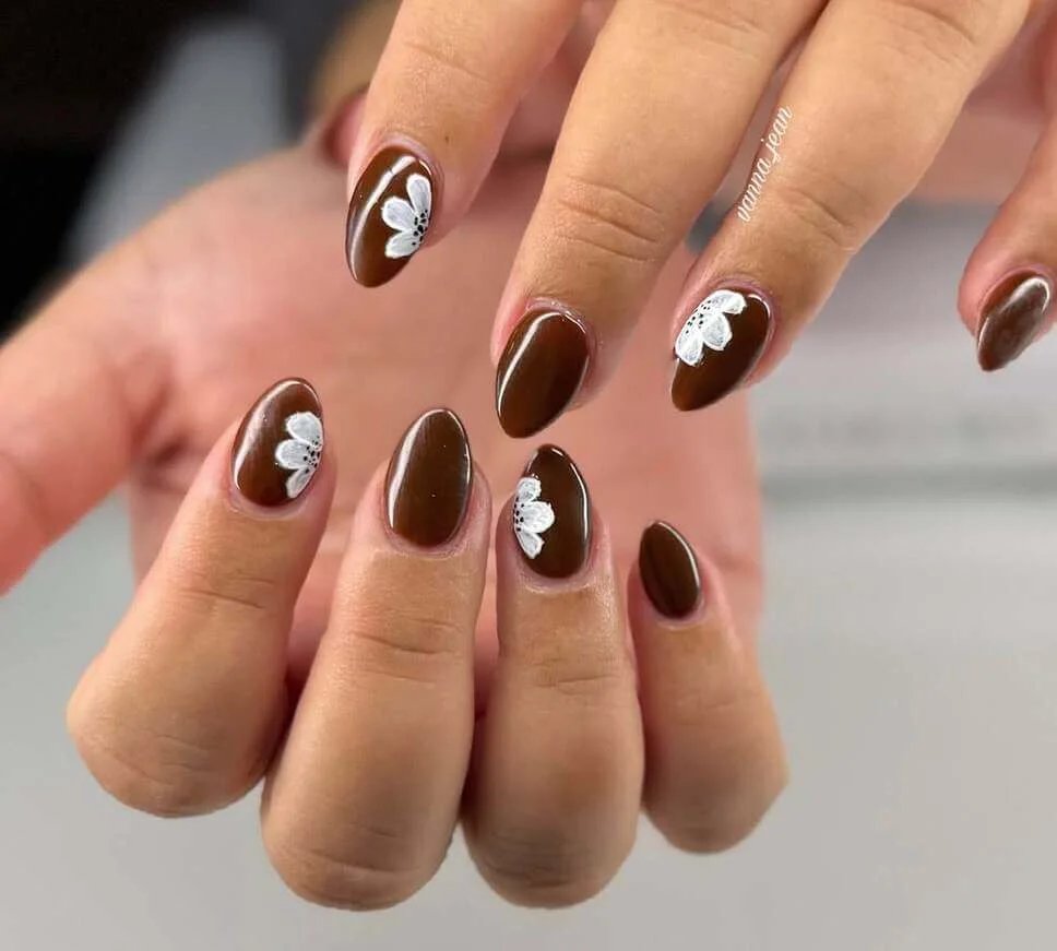Brown nails with white flowers