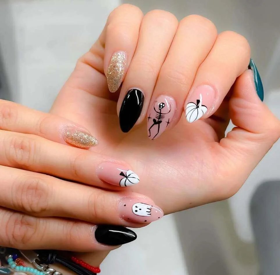 Glittery gold and black Halloween nails