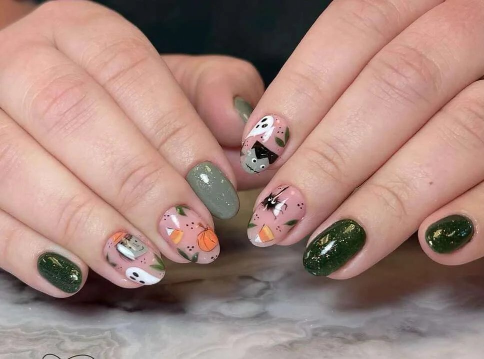 Green nails with candy corn and Mickey ghosts