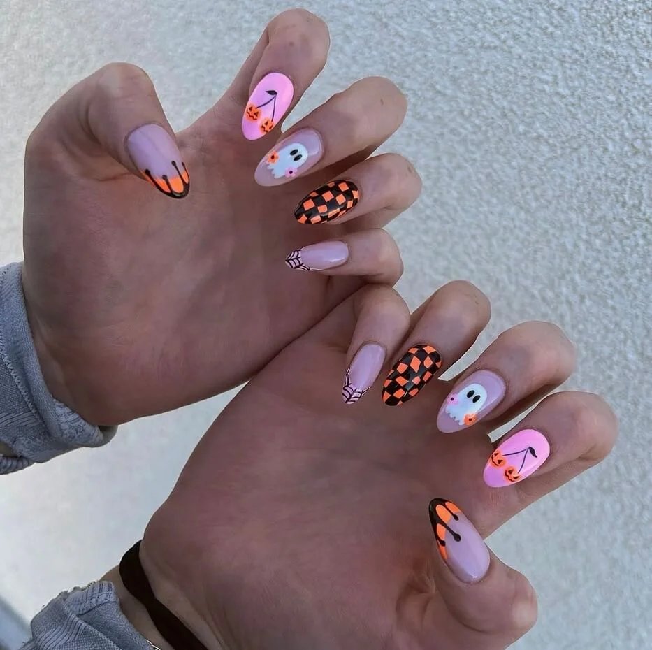 Pink Halloween nails with playful details