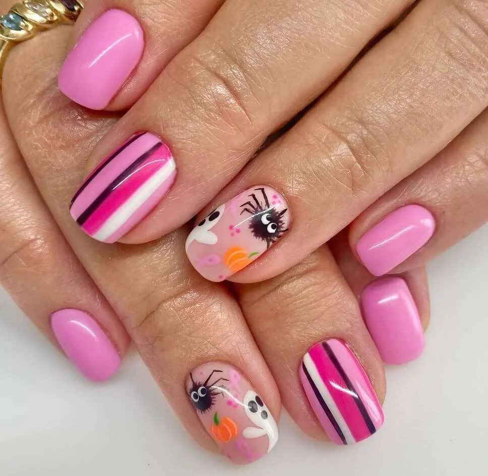 Pink striped nails with spiders