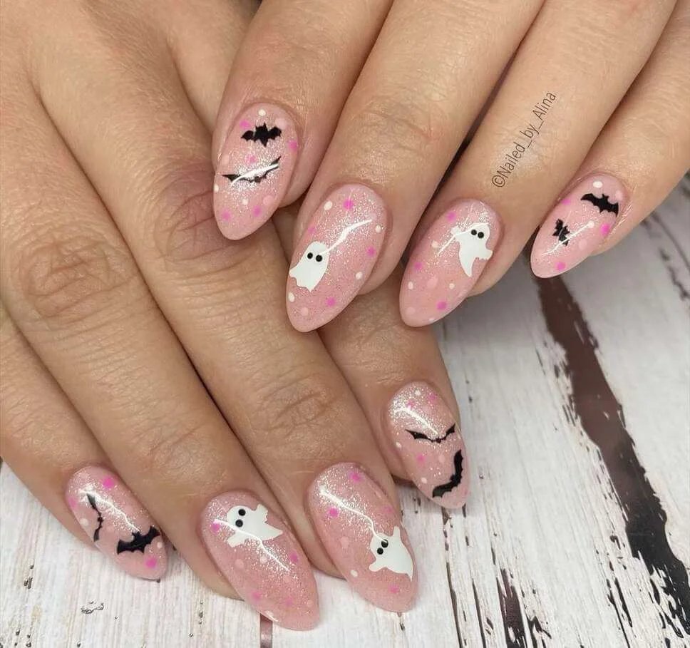 Sparkly pink nails with ghosts and bats