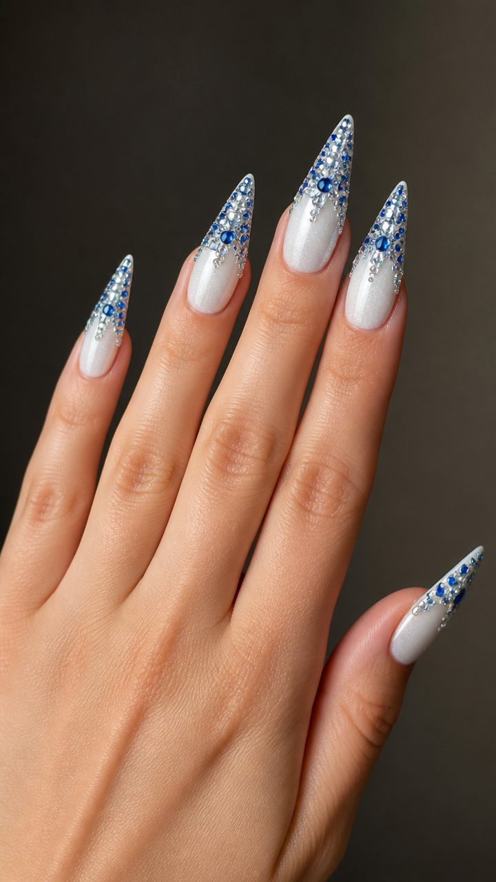 Icy White Stiletto Nails with Blue Rhinestone Frosting
